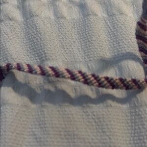 White Textured Fabric with Purple and White Trim